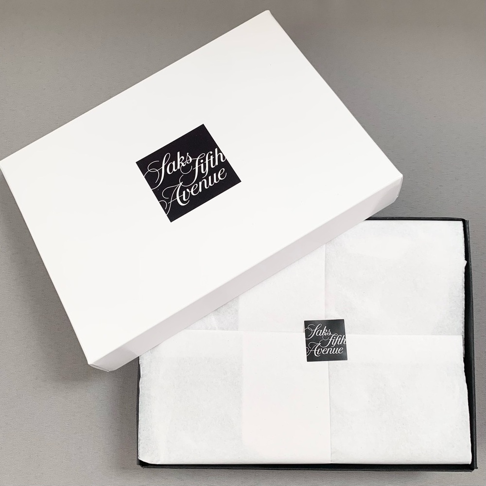 Hold Saks Fifth Avenue gift boxes